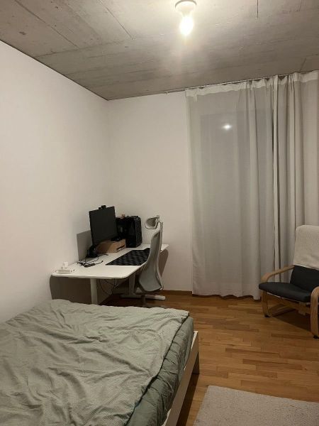 room with bed, desk, chair